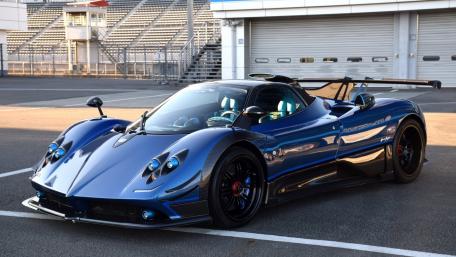 Sleek Blue Supercar on the Racing Track wallpaper