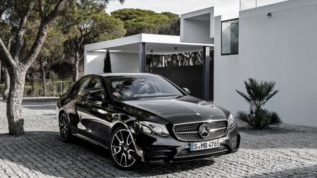 Sleek Black Mercedes Benz in Modern Setting wallpaper