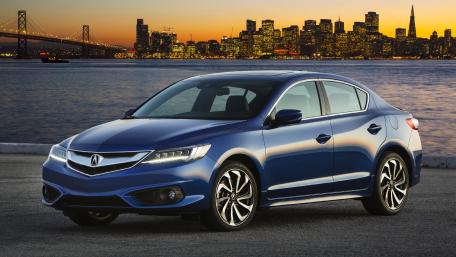 Sleek Blue Sedan Against a City Skyline at Dusk wallpaper