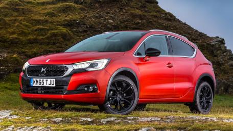 Sleek Red Crossover in Natural Terrain wallpaper