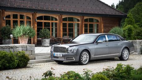 Elegant Luxury Car Surrounded by Nature wallpaper
