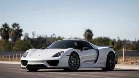 Sleek White Sports Car on a Sunny Road wallpaper
