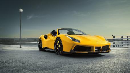 Sleek Yellow Sports Car on the Waterfront wallpaper