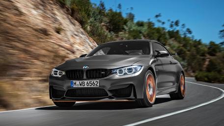 Sleek BMW M4 on a Scenic Drive in 4K Resolution wallpaper