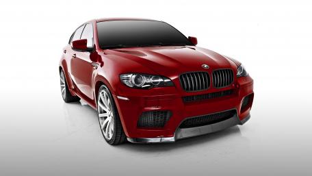 Sleek Red BMW X6 with Bold Presence wallpaper