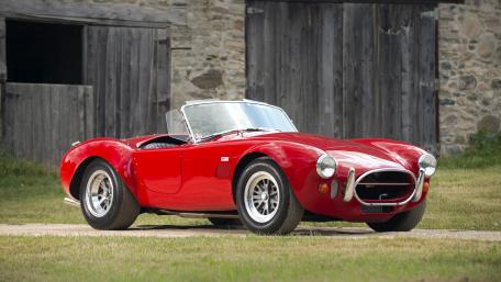 Classic Red Sports Car Elegance and Power wallpaper