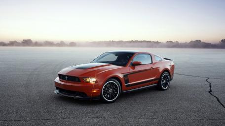 Sleek Mustang on a Misty Track wallpaper