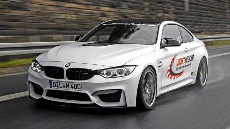 Sleek BMW M4 Racing Through the Rain wallpaper
