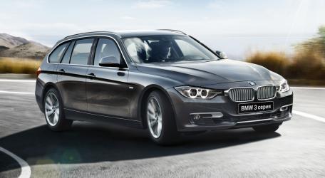 Sleek BMW 3 Series on a Scenic Road wallpaper