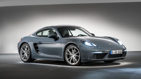 Sleek Porsche 718 Cayman in Modern Showcase wallpaper