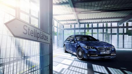 Sleek Car in Modern Garage Setting wallpaper