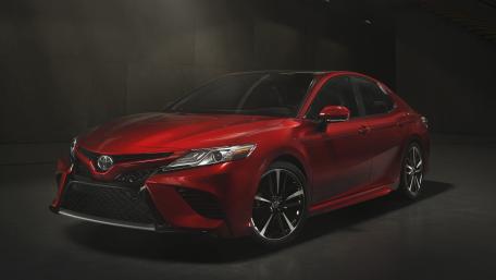 Sleek Red Toyota Camry in Shadows wallpaper