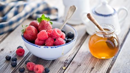 Fresh Berries and Honey Delightful Scene wallpaper