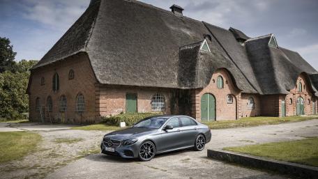 Elegant Mercedes Benz Against Rustic Barn Background in 4K Quality wallpaper