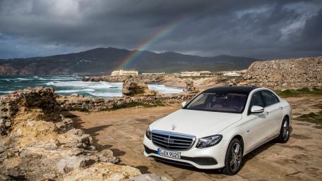 Elegant Mercedes by the Coast with a Rainbow View wallpaper