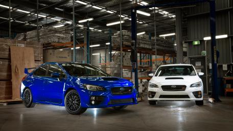 Sleek Subaru Twins in Industrial Setting wallpaper