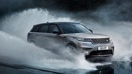 Powerful SUV in Motion on Water Splashing Surface wallpaper