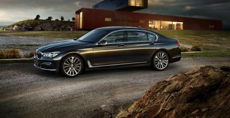 Sleek Luxury BMW in a Modern Landscape wallpaper