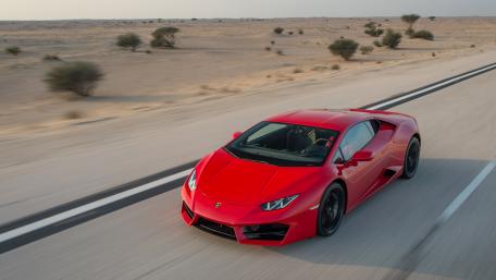 Sleek Red Sports Car in Desert Landscape wallpaper