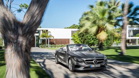 Sleek Luxury Convertible on a Scenic Drive wallpaper