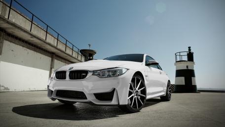 Sleek White BMW on a Stunning Daylight Setting wallpaper