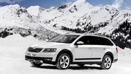 Sleek SUV in a Winter Wonderland wallpaper