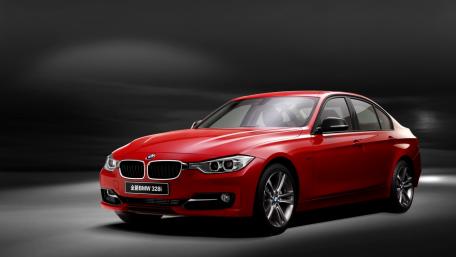 Sleek Red BMW 328i in Daring Ambiance wallpaper