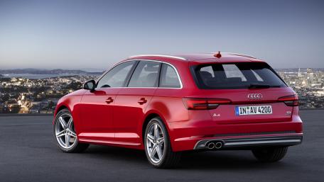 Sleek Red Audi in Urban Landscape View wallpaper