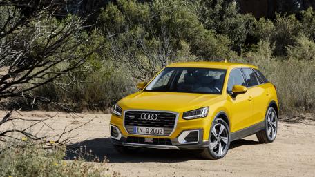 Vibrant Yellow Audi SUV in Nature Landscape wallpaper
