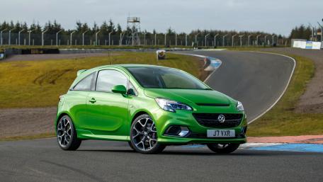 Vibrant Green Sporty Car on Track wallpaper
