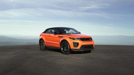 Vibrant Range Rover Evoque in Scenic Landscape wallpaper