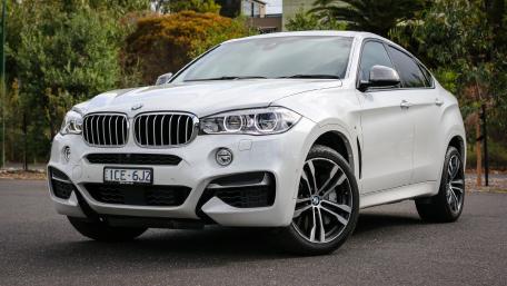 Sleek White BMW SUV on a Scenic Background wallpaper
