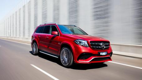 Sleek Red Luxury SUV on the Move wallpaper