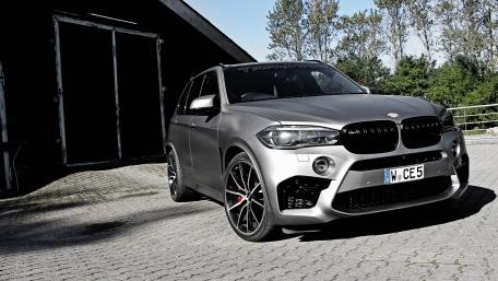 Sleek BMW X5 in Urban Setting wallpaper