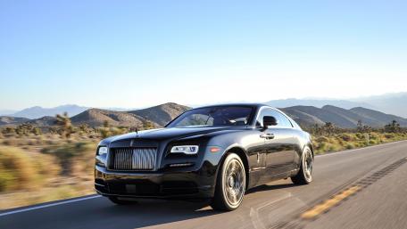 Sleek Black Luxury Car on Open Road wallpaper