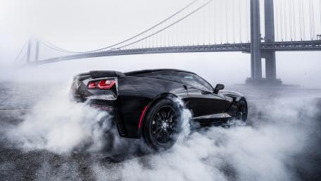 Dynamic Black Sports Car in Action wallpaper