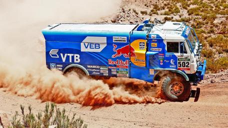 Rugged Power Racing Through Dust Clouds wallpaper