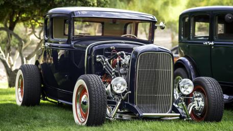 Classic Antique Car on Green Grass Lawn wallpaper