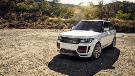 Sleek White SUV in Nature's Embrace wallpaper