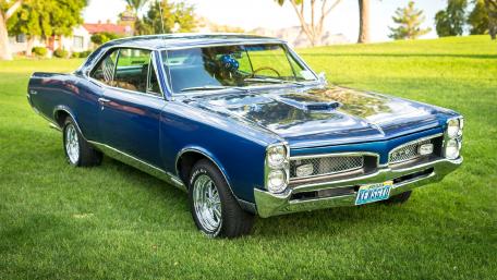 Classic Blue Muscle Car on a Sunny Day wallpaper