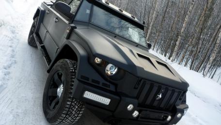 Bold Matte Black SUV in a Snowy Landscape wallpaper