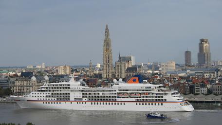 Majestic Cruise Ship in Urban Harbor Scene wallpaper