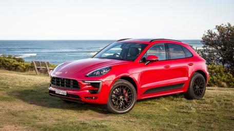 Sleek Red SUV by the Ocean wallpaper