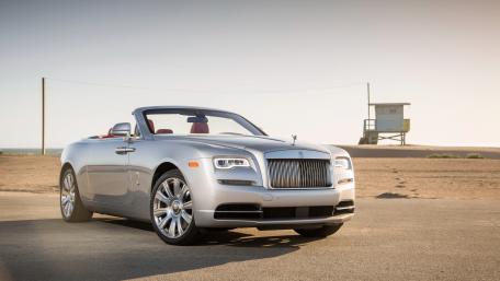 Sleek Luxury Convertible on a Coastal Road wallpaper