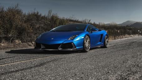 Sleek Blue Sports Car on an Open Road wallpaper