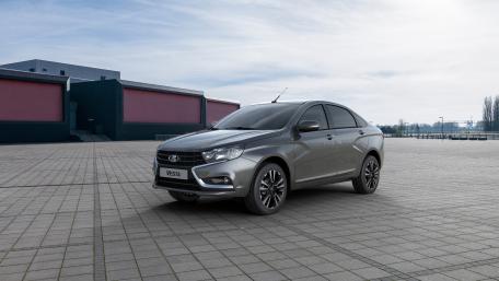 Sleek Lada Vesta in Urban Setting wallpaper
