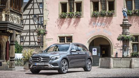 Sleek Mercedes in Charming European Village Scene wallpaper