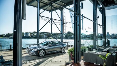 Sleek Car by the Water’s Edge wallpaper