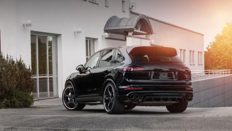 Sleek Black SUV in Urban Setting wallpaper