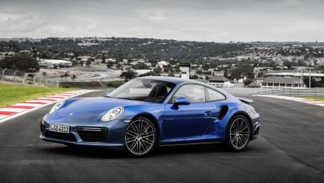 Sleek Blue Porsche on Race Track Mindset of Speed and Luxury wallpaper